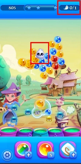 Mode roda di Bubble Witch 2. Stella perlu membebaskan hantu dengan membersihkan gelembung di sekitarnya.
